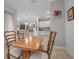 Inviting dining room featuring a wood table and views into the kitchen and living areas at 13303 Swiftwater Way, Lakewood Ranch, FL 34211