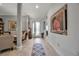 Bright foyer area with a decorative glass front door, art, and neutral decor creating an inviting atmosphere at 13303 Swiftwater Way, Lakewood Ranch, FL 34211