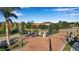 View of the community's gated entrance on a bright day with well-manicured landscaping at 13303 Swiftwater Way, Lakewood Ranch, FL 34211