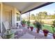 View of a covered and screened lanai overlooking the well manicured back yard at 13303 Swiftwater Way, Lakewood Ranch, FL 34211