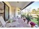 View of a covered and screened lanai overlooking the well manicured back yard at 13303 Swiftwater Way, Lakewood Ranch, FL 34211