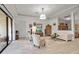 Inviting living room with bright light features, wood floors, neutral colors, and an open design at 13303 Swiftwater Way, Lakewood Ranch, FL 34211