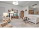 Cozy living room with wood floors, neutral furniture, and a well-lit space at 13303 Swiftwater Way, Lakewood Ranch, FL 34211