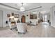 Comfortable living room featuring wood floors, neutral decor, and bright light at 13303 Swiftwater Way, Lakewood Ranch, FL 34211