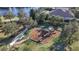 Aerial view of the community playground with swings and play structure, surrounded by green space at 13303 Swiftwater Way, Lakewood Ranch, FL 34211