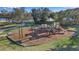 Playground featuring a climbing structure with slides and swings set on a safety surface at 13303 Swiftwater Way, Lakewood Ranch, FL 34211