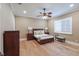 Bedroom featuring hardwood floors, ceiling fan, and bright natural light at 16416 Baycross Dr, Lakewood Ranch, FL 34202