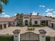 Elegant Mediterranean-style home showcasing a stately entrance, circular driveway, and manicured landscaping at 16416 Baycross Dr, Lakewood Ranch, FL 34202