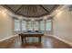 Game room showcasing a billiard table, trey ceiling, designer lighting, and abundant natural light at 16416 Baycross Dr, Lakewood Ranch, FL 34202