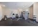 A well-equipped home gym with a variety of exercise equipment and mirrors provides the perfect space for fitness at 16416 Baycross Dr, Lakewood Ranch, FL 34202