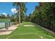 Lush putting green area with a manicured lawn and meticulously trimmed borders at 16416 Baycross Dr, Lakewood Ranch, FL 34202