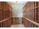 Custom wine cellar with extensive wooden racking for bottle storage at 16416 Baycross Dr, Lakewood Ranch, FL 34202