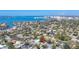 Scenic aerial shot of a neighborhood with waterfront views and a city skyline in the distance at 1687 Arlington St, Sarasota, FL 34239