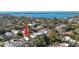 Overhead view of a neighborhood showcasing the property's location among lush greenery and nearby waterways at 1687 Arlington St, Sarasota, FL 34239