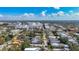 High angle aerial shot of neighborhood with mature trees and buildings, with some water views at 1687 Arlington St, Sarasota, FL 34239