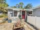 Charming patio area with bench seating, lush plants, and cozy ambiance at 1687 Arlington St, Sarasota, FL 34239