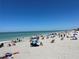 Expansive beach scene with sunbathers, clear blue skies and water at 1687 Arlington St, Sarasota, FL 34239