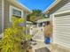 Charming entrance with white picket gate, landscaping, and paver pathway at 1687 Arlington St, Sarasota, FL 34239