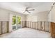 Bedroom featuring a sliding glass door to the yard, large windows, and a ceiling fan at 1719 New Hampshire Ne Ave, St Petersburg, FL 33703