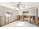 Bedroom featuring a large window offering plenty of natural light and a ceiling fan at 1719 New Hampshire Ne Ave, St Petersburg, FL 33703