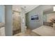 Tastefully designed bathroom with a walk-in shower, tiled walls, and modern fixtures at 1735 Flower Dr, Sarasota, FL 34239