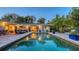 Inviting pool area with outdoor seating and lush landscaping, perfect for relaxation and entertainment at 1735 Flower Dr, Sarasota, FL 34239