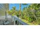 Charming balcony overlooking lush tropical landscaping, offering a serene outdoor retreat at 1919 Irving St, Sarasota, FL 34236