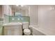 Bathroom showcasing green accents, subway tile in the shower, and classic finishes at 1919 Irving St, Sarasota, FL 34236