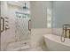 Bathroom featuring walk-in shower, soaking tub and dual shower head at 1919 Irving St, Sarasota, FL 34236