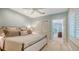 Serene bedroom with a comfortable king-size bed, neutral tones, and access to a private balcony at 1919 Irving St, Sarasota, FL 34236