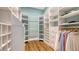 Spacious walk-in closet with custom shelving and hanging racks at 1919 Irving St, Sarasota, FL 34236