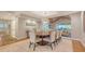 Elegant dining room with wood ceiling and view into the living room at 1919 Irving St, Sarasota, FL 34236