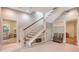 Bright Foyer showcases stairs with wood and white features and tile floors at 1919 Irving St, Sarasota, FL 34236