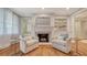 Inviting living room with a fireplace and built-in shelving at 1919 Irving St, Sarasota, FL 34236