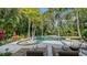 Private backyard pool and spa area surrounded by lush tropical landscaping at 1919 Irving St, Sarasota, FL 34236