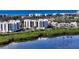 Aerial view of the condominium building and surrounding mangroves and water at 1932 Harbourside Dr # 244, Longboat Key, FL 34228