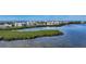 High angle aerial shot of condominiums by the coast offering a picturesque waterfront view at 1932 Harbourside Dr # 244, Longboat Key, FL 34228