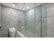 Sleek bathroom features a glass-enclosed shower with multi-spray features and modern commode at 1932 Harbourside Dr # 244, Longboat Key, FL 34228