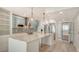 Bright kitchen boasts a large island, modern appliances, and stylish pendant lighting at 1932 Harbourside Dr # 244, Longboat Key, FL 34228