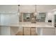 Contemporary kitchen with an island, glass-front cabinets, and modern appliances at 1932 Harbourside Dr # 244, Longboat Key, FL 34228