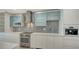 Bright kitchen featuring modern appliances and light finishings at 1932 Harbourside Dr # 244, Longboat Key, FL 34228