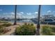 Scenic marina view featuring boats docked on a sunny day with palms in foreground at 1932 Harbourside Dr # 244, Longboat Key, FL 34228