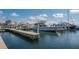 Scenic marina view of boats docked along a pier on a bright, sunny day at 1932 Harbourside Dr # 244, Longboat Key, FL 34228