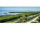 Scenic water view featuring lush greenery, with a glimpse of the cityscape in the distance at 1932 Harbourside Dr # 244, Longboat Key, FL 34228