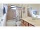 Bathroom featuring tiled shower, tub, and vanity with modern fixtures at 20170 Benissimo Dr, Venice, FL 34293