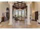 Elegant lobby area with soaring ceilings, decorative columns, and stylish furnishings at 20170 Benissimo Dr, Venice, FL 34293