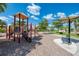 Fun playground area with climbing structures, a slide, and shaded seating for parents at 20170 Benissimo Dr, Venice, FL 34293