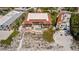 Drone shot of the beach-side property, with pool, outdoor lounge areas, and beach access at 224 17Th St # 224, Bradenton Beach, FL 34217