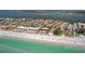 Beautiful aerial view of beachfront condos, turquoise water, and sandy beach at 224 17Th St # 224, Bradenton Beach, FL 34217