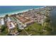 Aerial view of the community featuring access to the beach and bay, well-maintained landscaping, and community pool at 224 17Th St # 224, Bradenton Beach, FL 34217